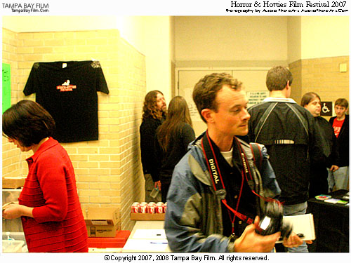 The Horror & Hotties film festival had a robust crowd. Hey, who's the other photographer? Oh, I want that shirt on the wall!